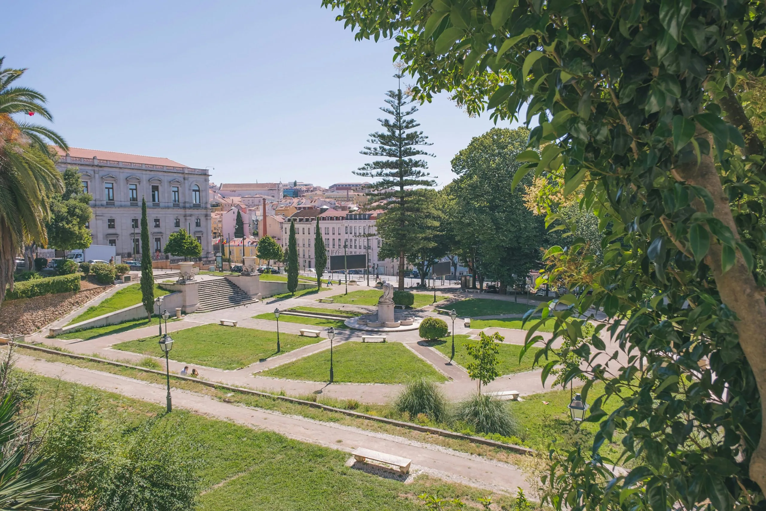Public garden with lawns, palms and pines in the Estrela parish of Lisbon