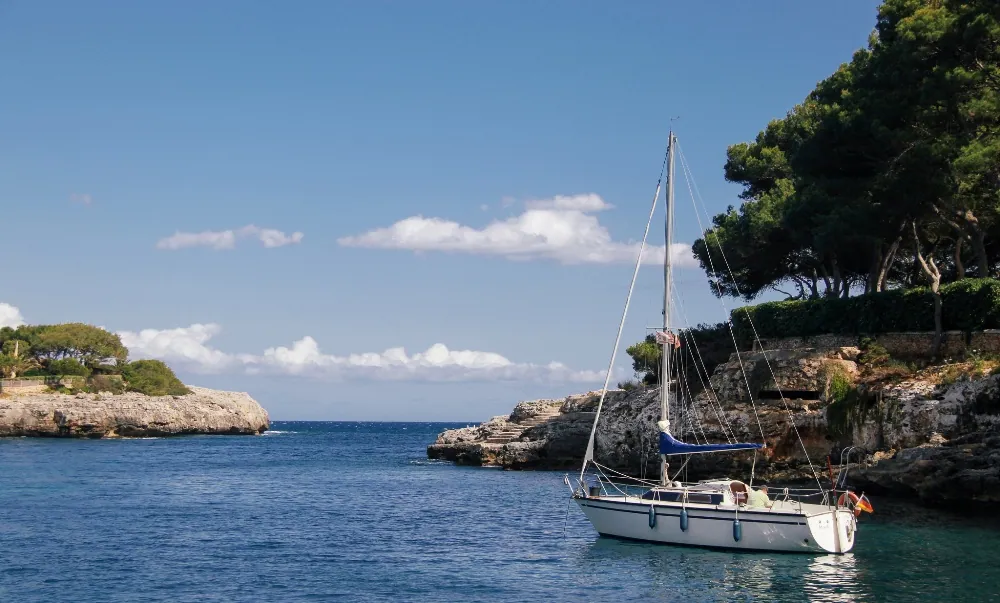 Yachts and turquoise sea in the coastal resort of Cala d'Or