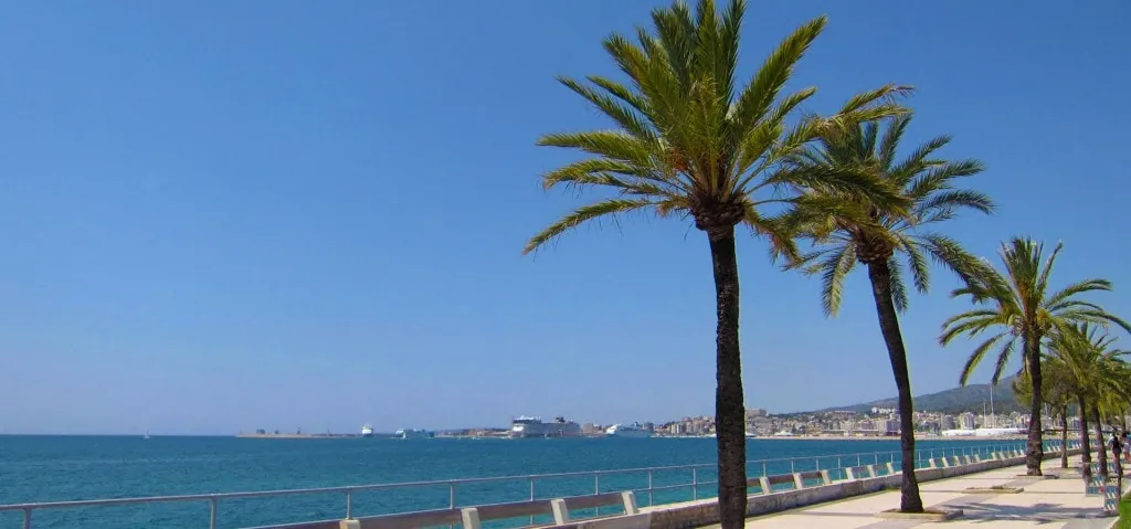 Ciudad Jardin El Molinar Portitxol Portixol area of Palma de Mallorca with view over Porto Pi with cruise ships and palms sea living in Spain